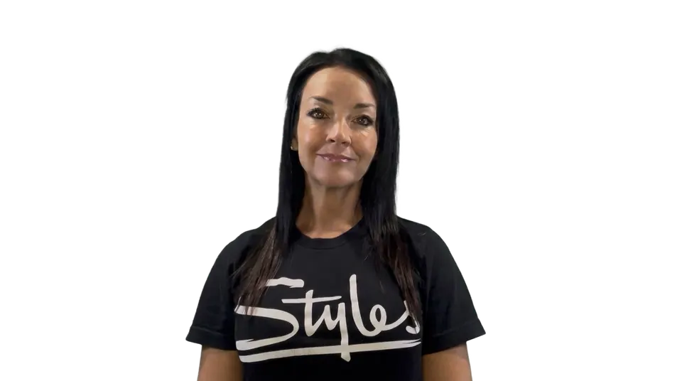 Carrie, the Styles Studios Fitness AI concierge, smiling