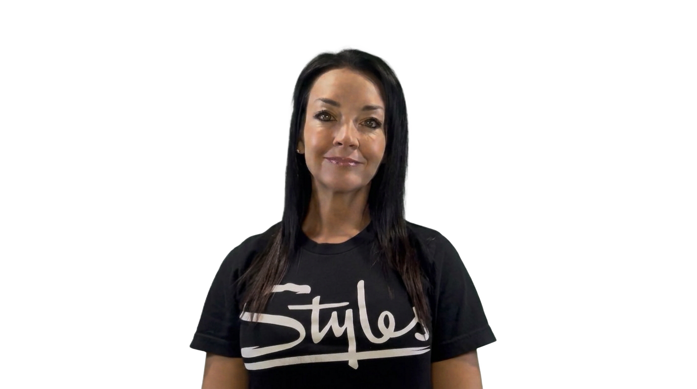 Carrie, the Styles Studios Fitness AI concierge, smiling